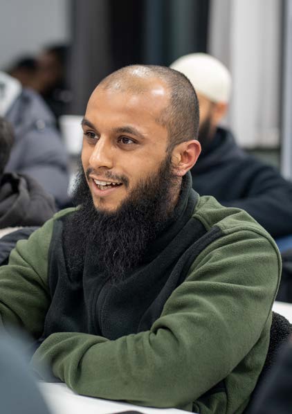 An Alimiyyah student smiling during a discussion